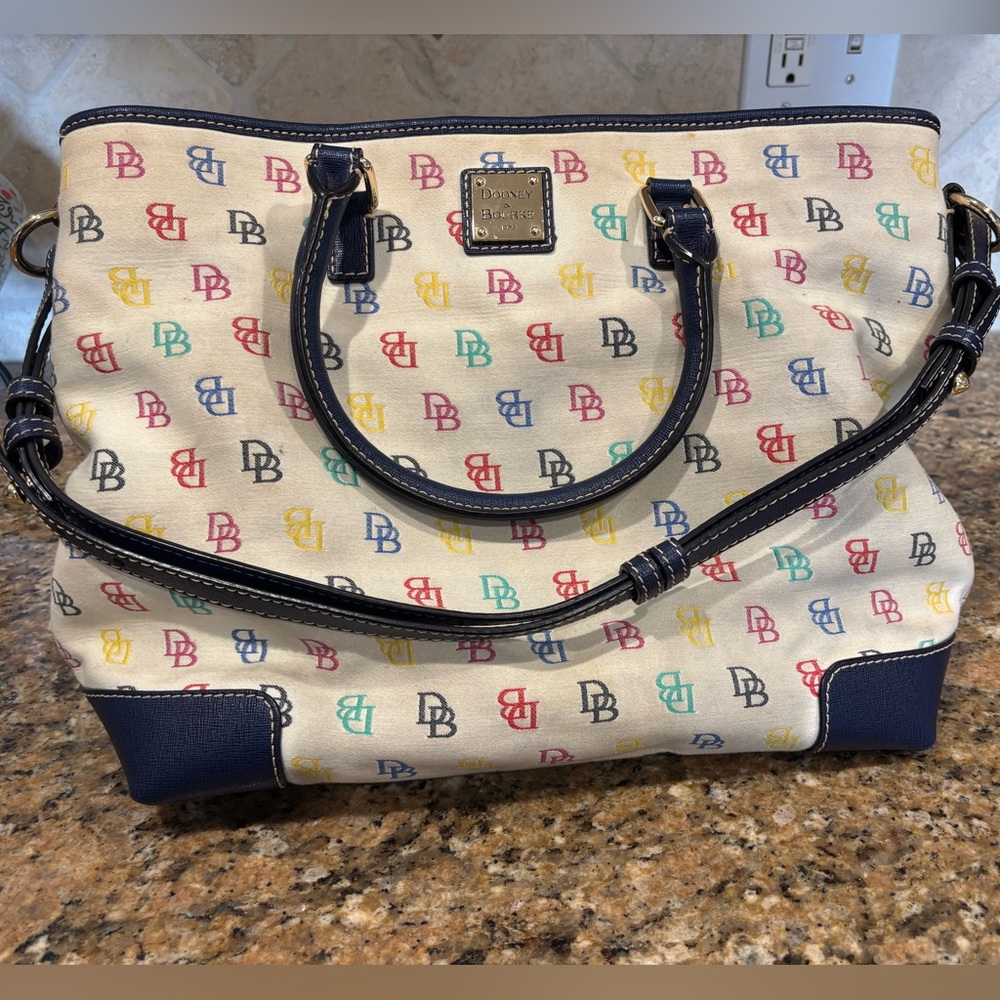 Dooney & Bourke white logo purse with matching wallet and makeup bag